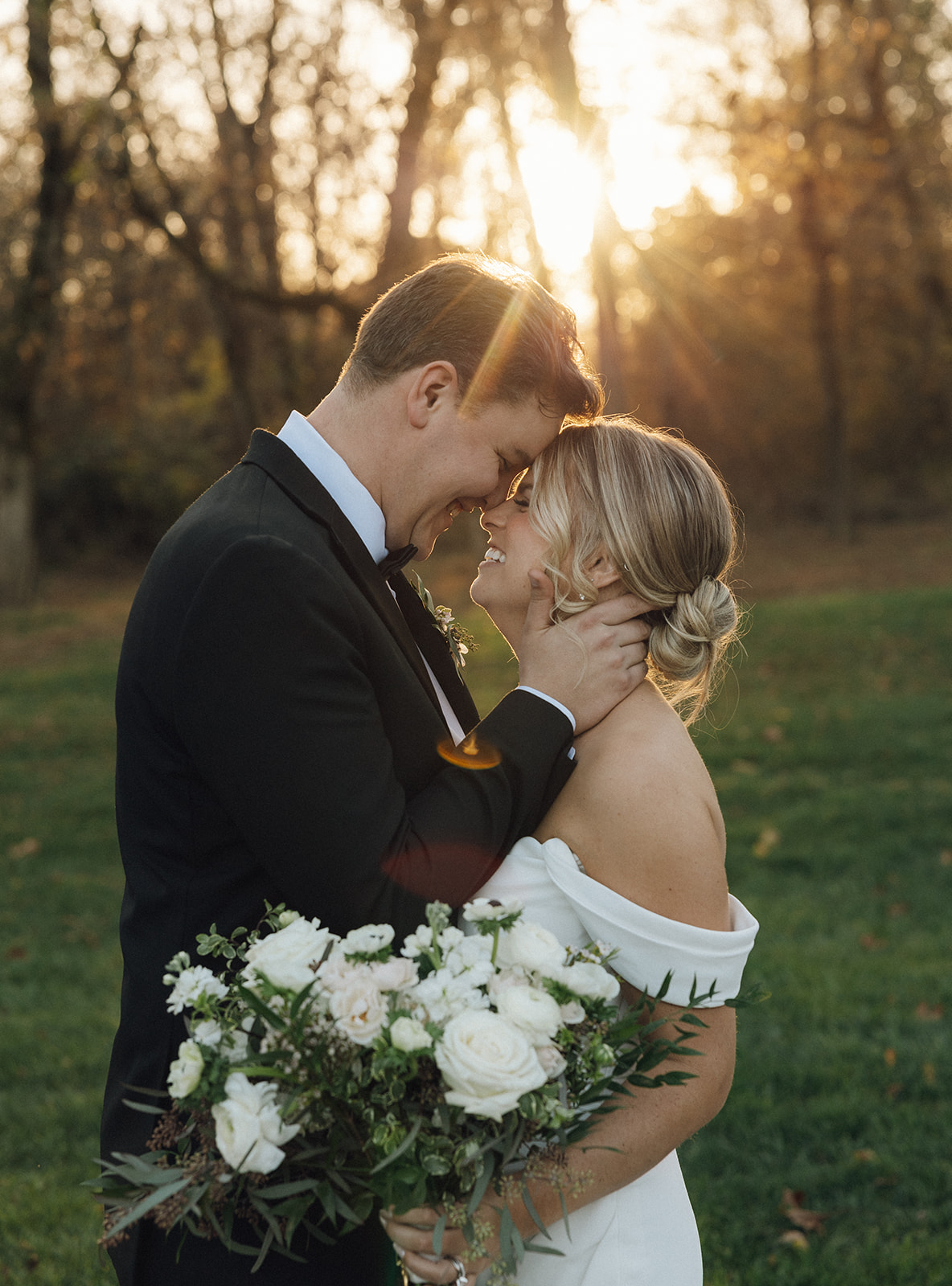 A bride and groom during their wedding portraits at golden hour.