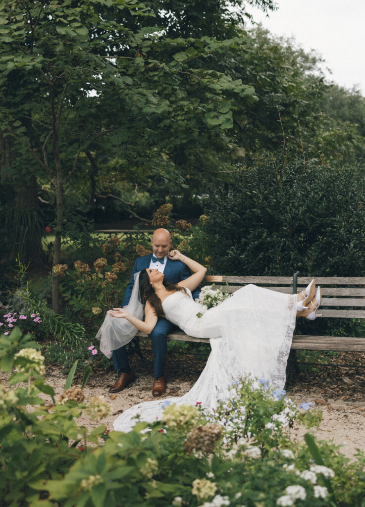 A bride and groom on their wedding day in a garden in Charleston, SC.