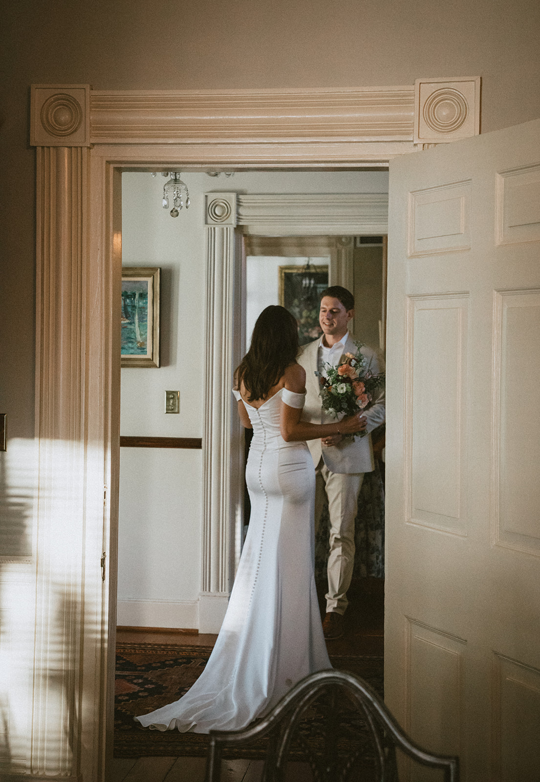 A bride and groom share precious moments together before their wedding ceremony.