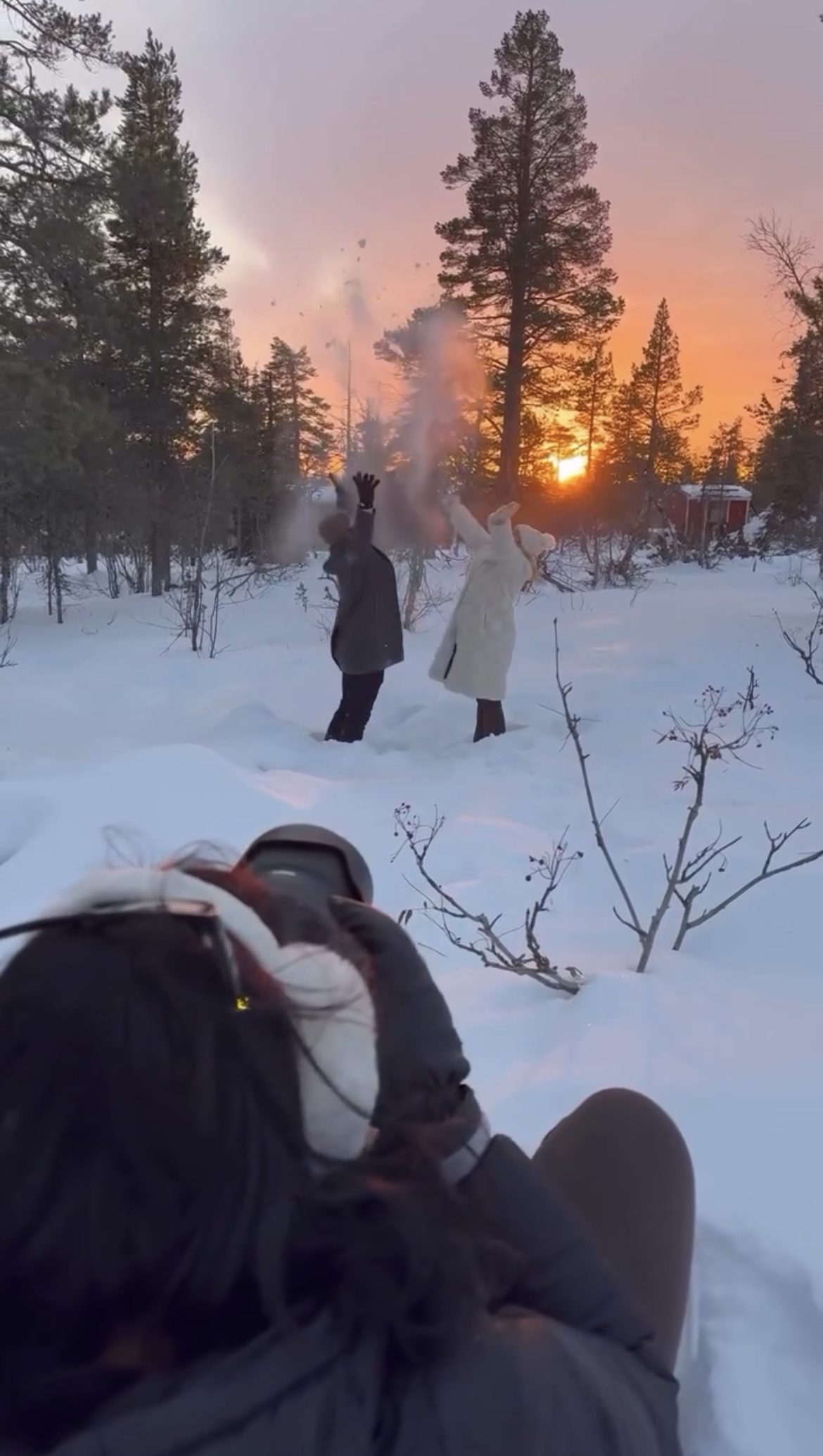 A couple poses for a snowy photoshoot in Finland.