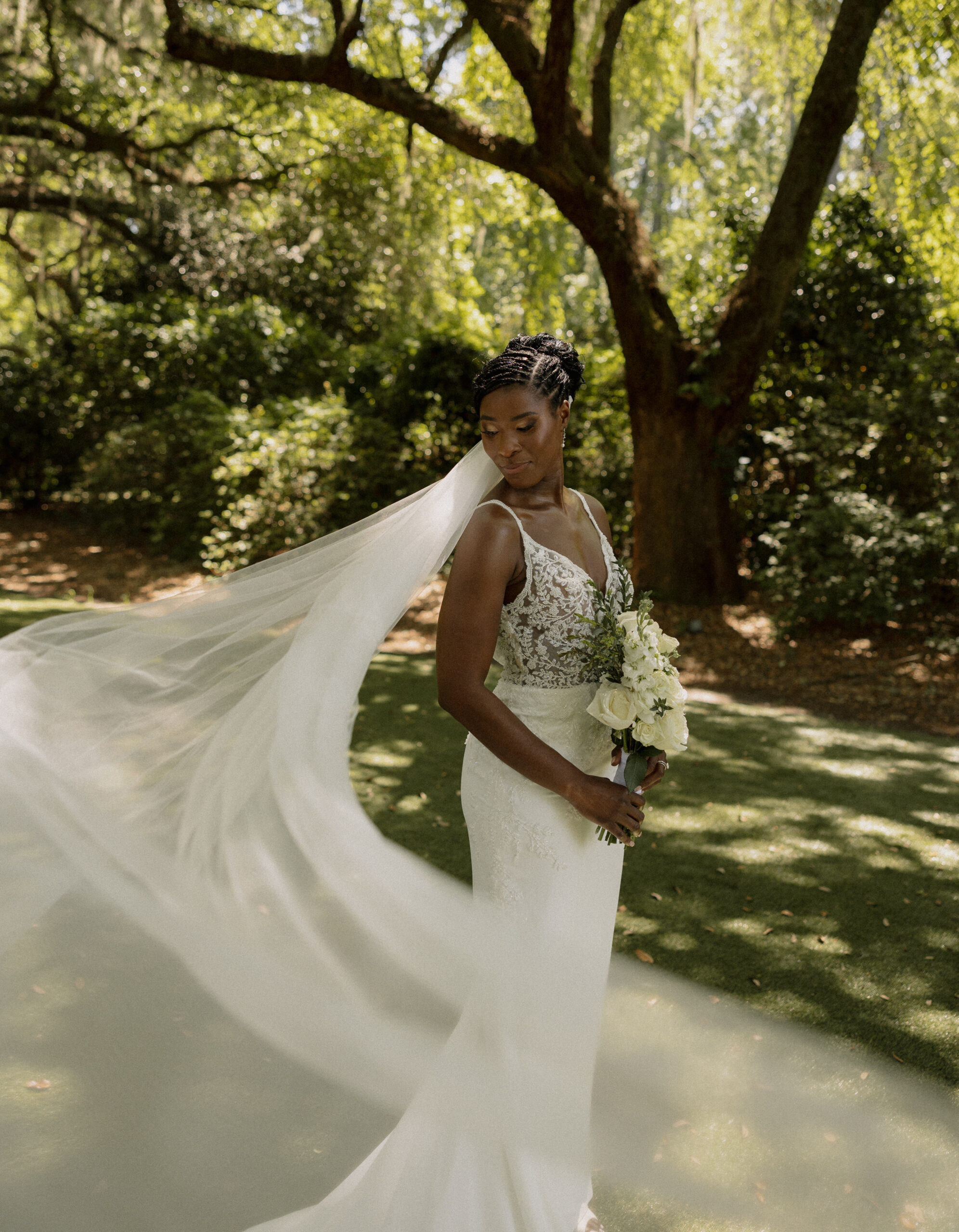 A bride and her swaying veil during elopement portraits.