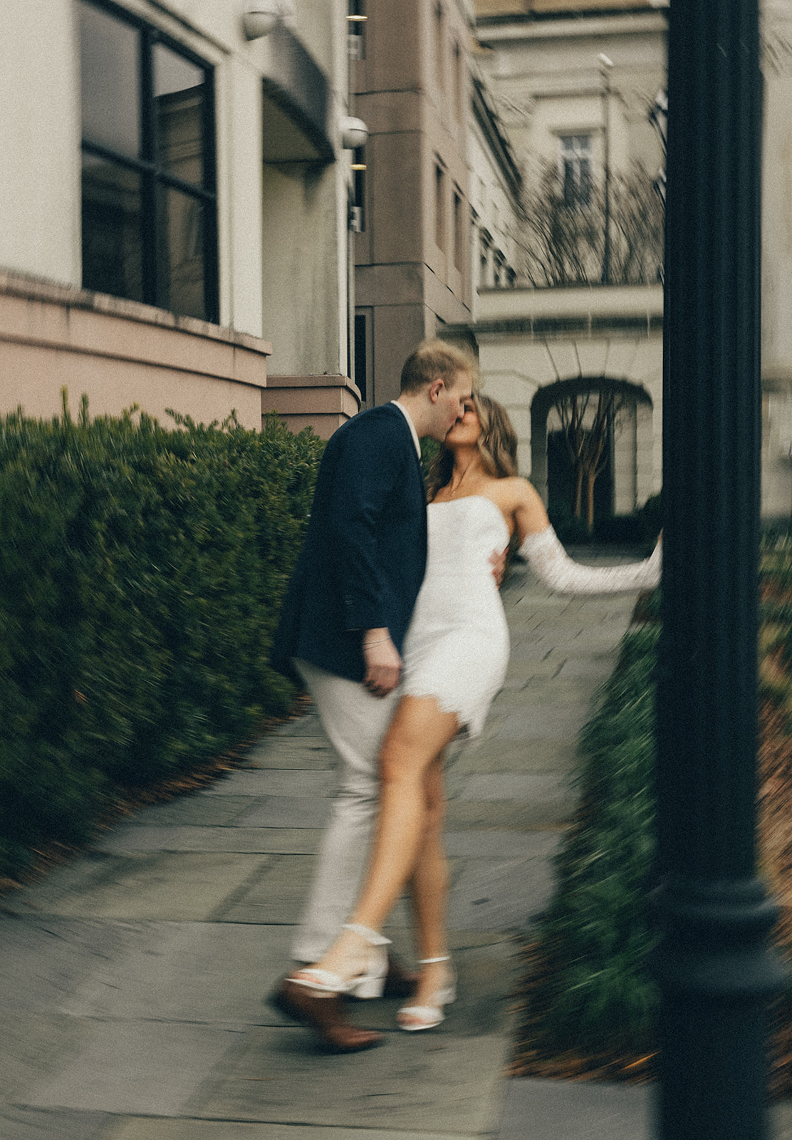 A couple poses for timeless engagement photos in downtown Charleston, SC.